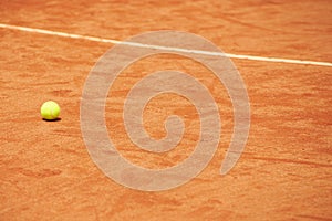 Tennis ball, clay court and space for fitness, sports or training outdoor in summer with no people. Exercise, health and