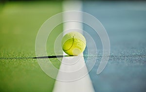 Tennis ball, court and green texture of line between grass and turf game with no people. Sports, empty sport training