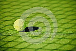 Tennis ball, court shadow and green texture of grass turf game with no people. Sports, empty sport training ground and