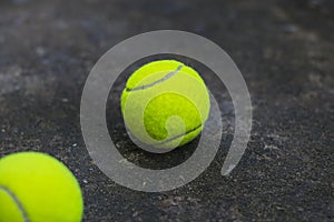 Tennis ball on the dirty ground