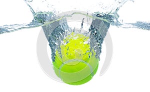 Tennis Ball falls into water and creates air bubbles on surface. Tennis green Ball drop hit smash to clear water and deep to