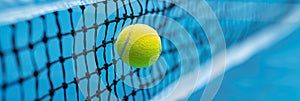 Tennis ball frozen in motion at net, showcasing precision, summer olympics sports concept