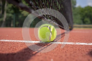 Tennis ball at the hard court surface corner line