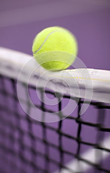 Tennis ball hitting the net