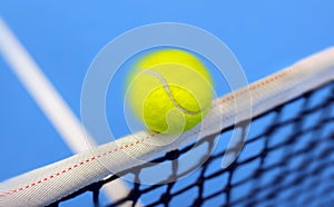 Tennis ball hitting the net