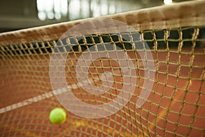 Tennis ball hitting net for fault