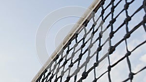 Tennis ball hitting net on sky background, player losing point, sport tournament