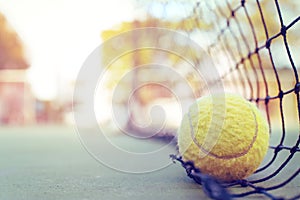Tennis ball hitting the tennis net at tennis court.