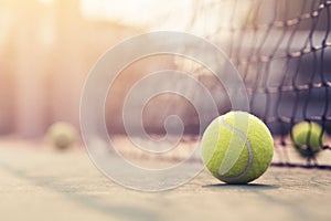 Tennis ball hitting the tennis net at tennis court.