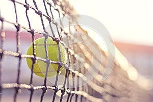 Tennis ball hitting to net