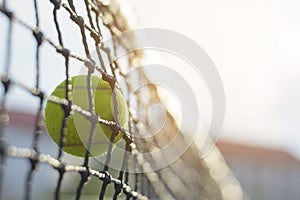 Tennis ball hitting to net