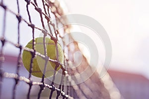 Tennis ball hitting to net