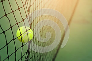 Tennis ball hitting to net