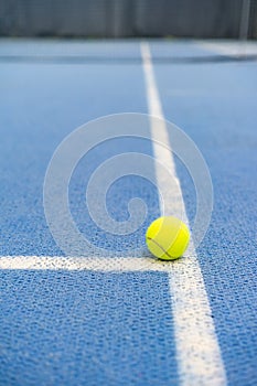 Tennis ball indoor on tennis court, white line