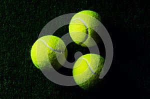 Tennis Ball isolated on black with dramatic lighting