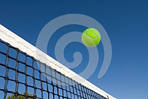 Tennis ball and net photo
