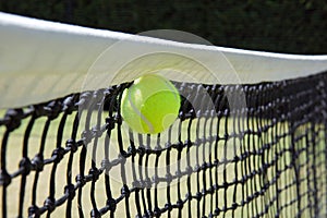 Tennis ball in net.