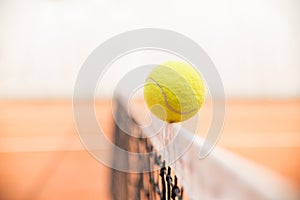 Tennis ball on the net