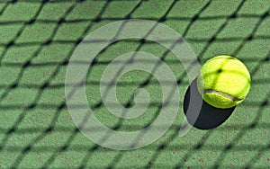 Tennis ball with net shadow