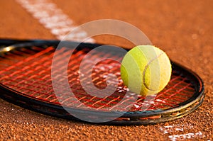 Tennis ball and racket photo