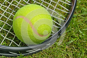 Tennis ball and racket close up