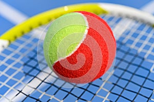 Tennis ball and racket close up in an outdoor court