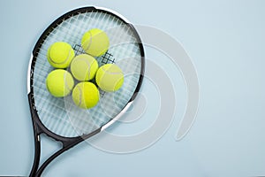 Tennis ball and racket isolated background. Top view