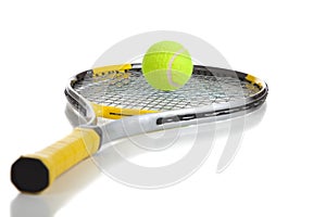 A tennis ball and racket on white