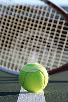 Tennis ball and racquet