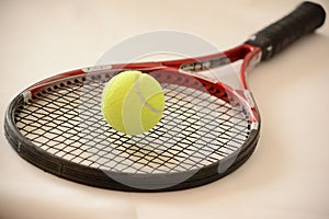 Tennis Ball on a Racquet