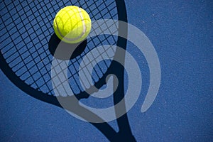Tennis ball in a racquet shadow photo