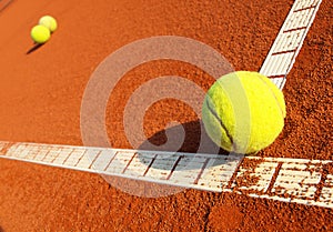 Tennis ball on a tennis court photo