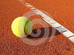 Tennis ball on a tennis court photo