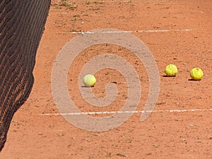 tennis balls on an amateur tennis court