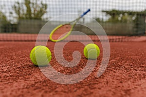Tennis balls on court photo