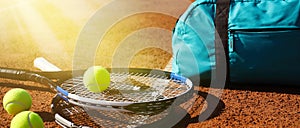 Tennis balls, rackets and bag on clay court, banner design