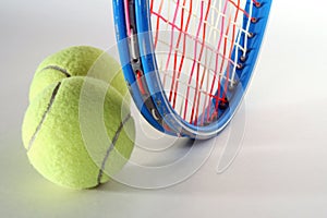 Tennis Balls and Raquet photo