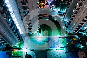 Tennis, basketball courts in skyscraper courtyard