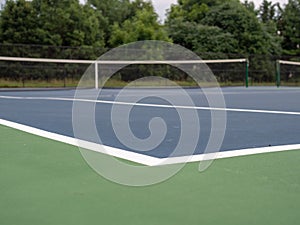 Tennis court bounds marker at a local small court, low angle view