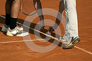 Tennis line referee and tennis player