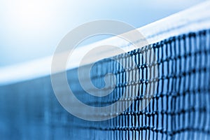 Tennis net and blue Tennis net and blue court. Individual sport. Blue filter. Individual sport. Blue filter