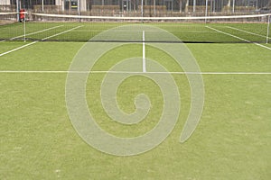 Tennis net on a green field