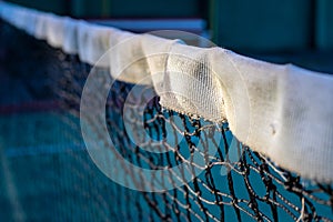 Tennis net photo. Black and white net of tennis court closeup. Sport field divider. Sport competitors opposite sites