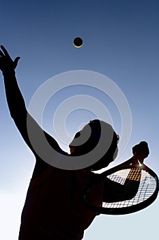 Tennis player and ball.