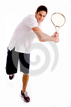 tennis player carrying racket