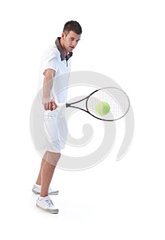 Tennis player doing backhand stroke photo