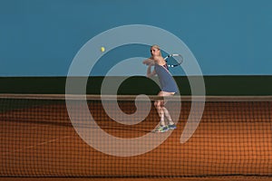 Tennis Player Hitting Tennis Ball