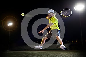 Tennis player at night