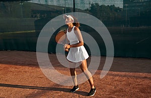 Tennis player with racket on court