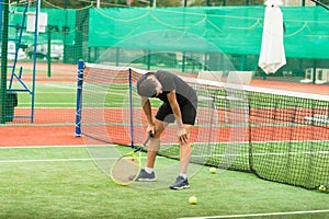 The tennis player is recuperating after another game of tennis. photo